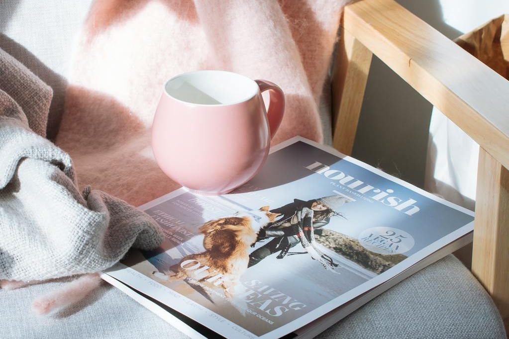 pink mug and magazine